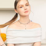 Raindrop Silver Lariat Necklace by Lavana, on model fine chain with polished modern twin droplet Y-pendant