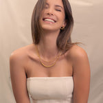 Raleigh Gold Station Chain Necklace by Lavana, on model; fuller bead stations along a classic fine chain