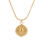 Ray of Sun Gold Pendant Necklace by Lavana, engraved sunburst coin, front view