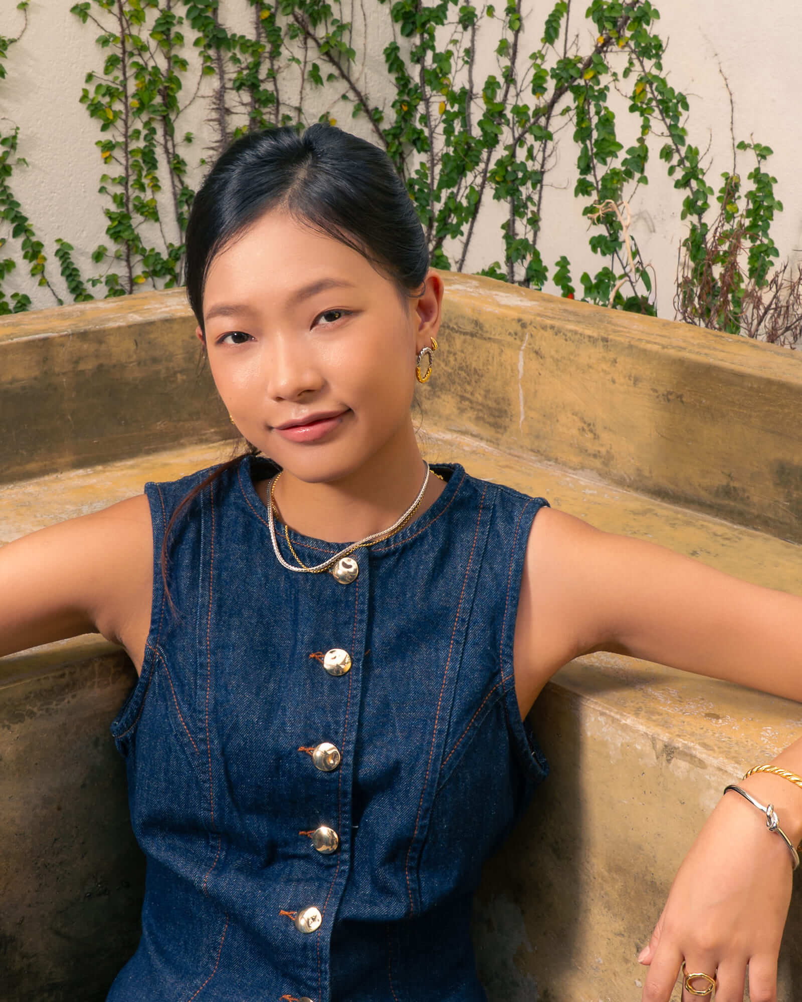 Reflection Two Tone Hoop Earrings by Lavana, on model; classic textured rope oval with silver top and gold base