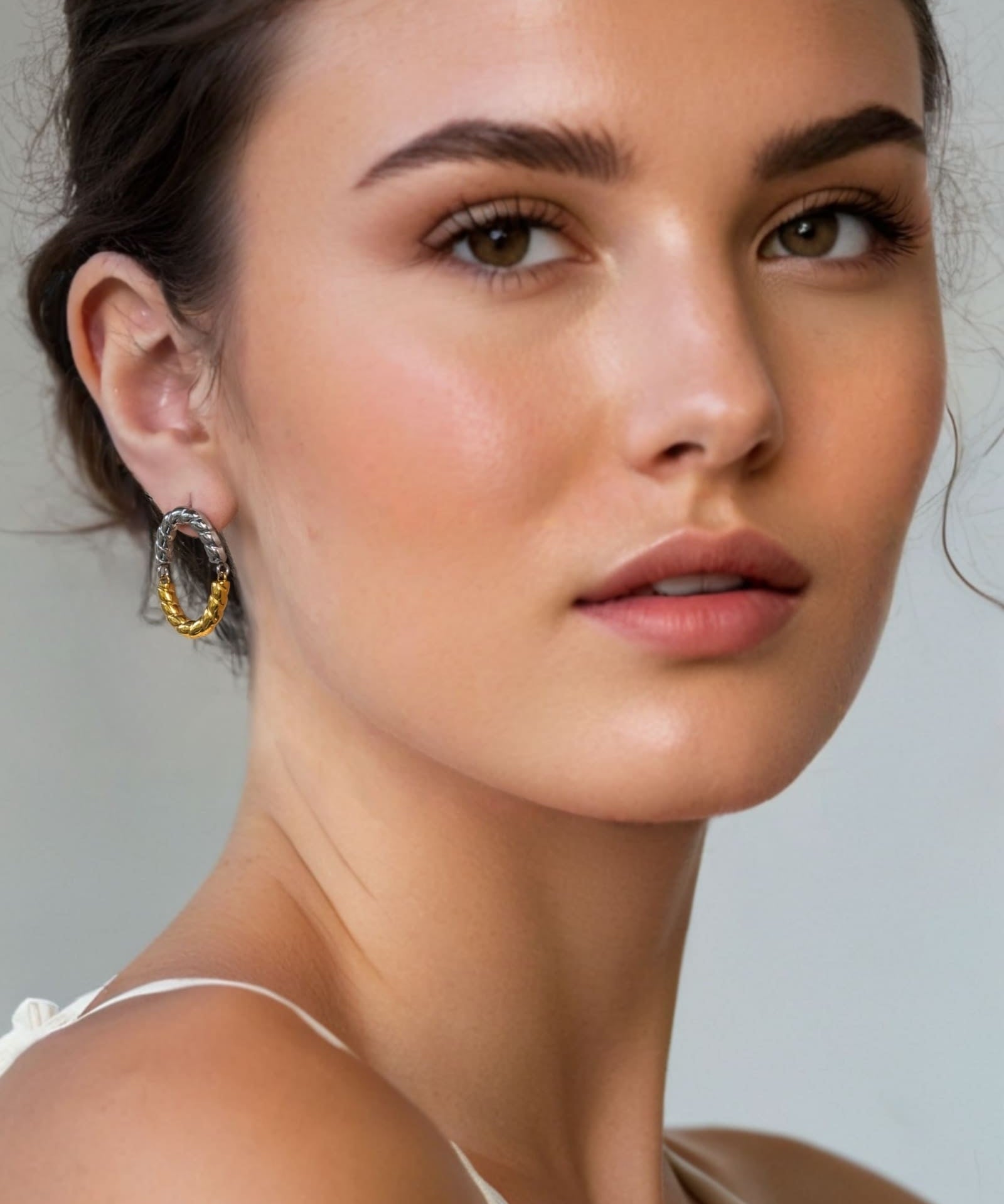 Reflection Two Tone Hoop Earrings by Lavana on model textured rope oval with silver top and gold base