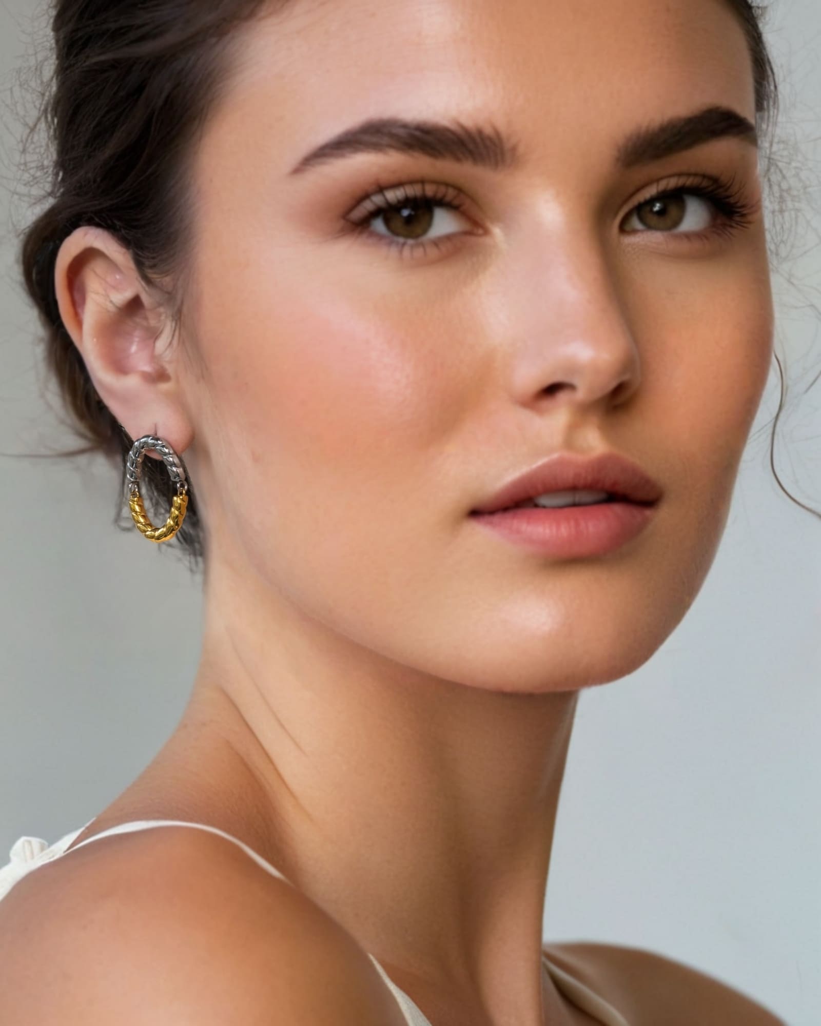 Reflection Two Tone Hoop Earrings by Lavana on model textured rope oval with silver top and gold base