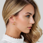 Rhombus Geometric Gold Hoop Earrings by Lavana on model with stacked rhombus prism shapes