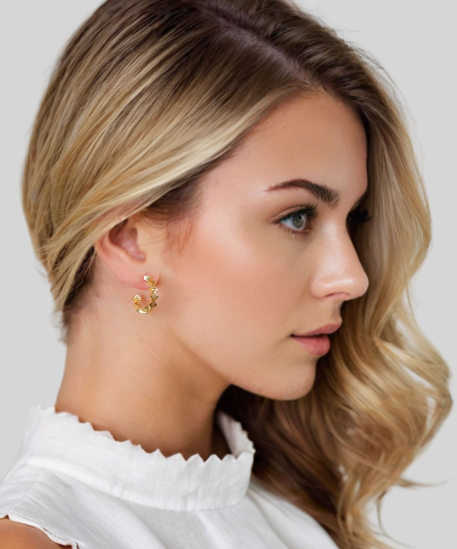 Rhombus Geometric Gold Hoop Earrings by Lavana on model with stacked rhombus prism shapes