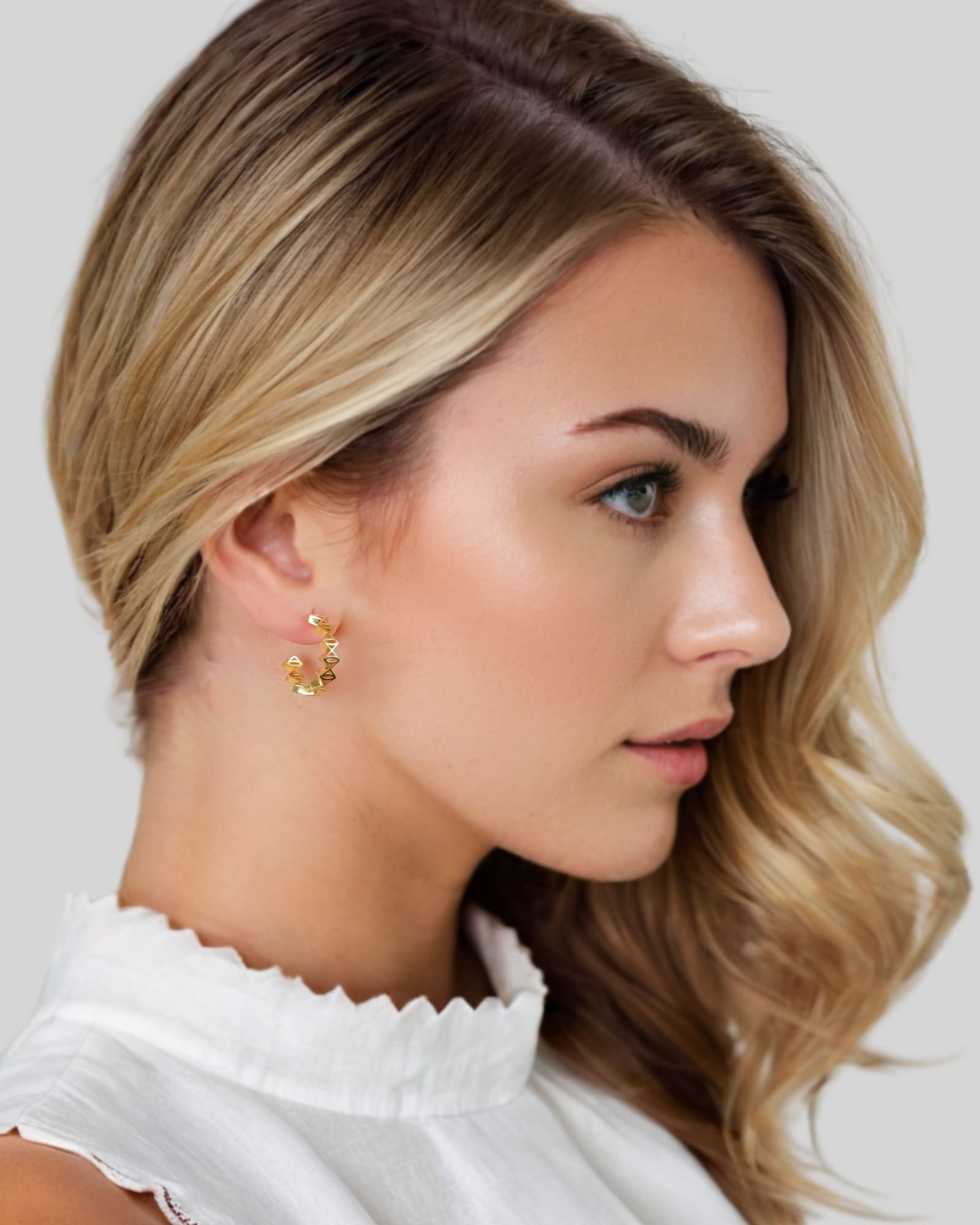 Rhombus Geometric Gold Hoop Earrings by Lavana on model with stacked rhombus prism shapes