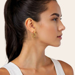 Ripples Gold Hoop Earrings by Lavana, on model; slim round hoops with organic textured ripples