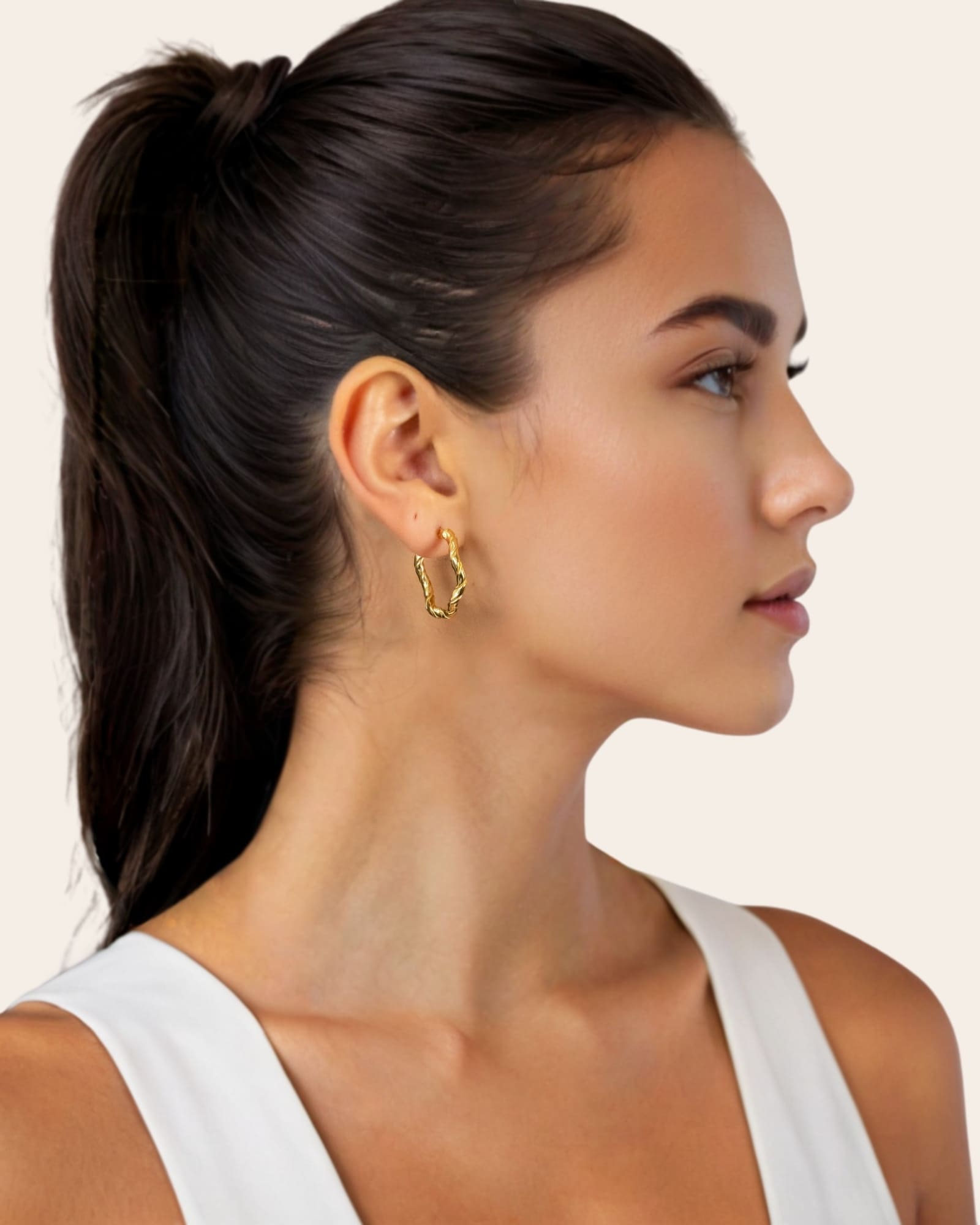 Ripples Gold Hoop Earrings by Lavana, on model; slim round hoops with organic textured ripples