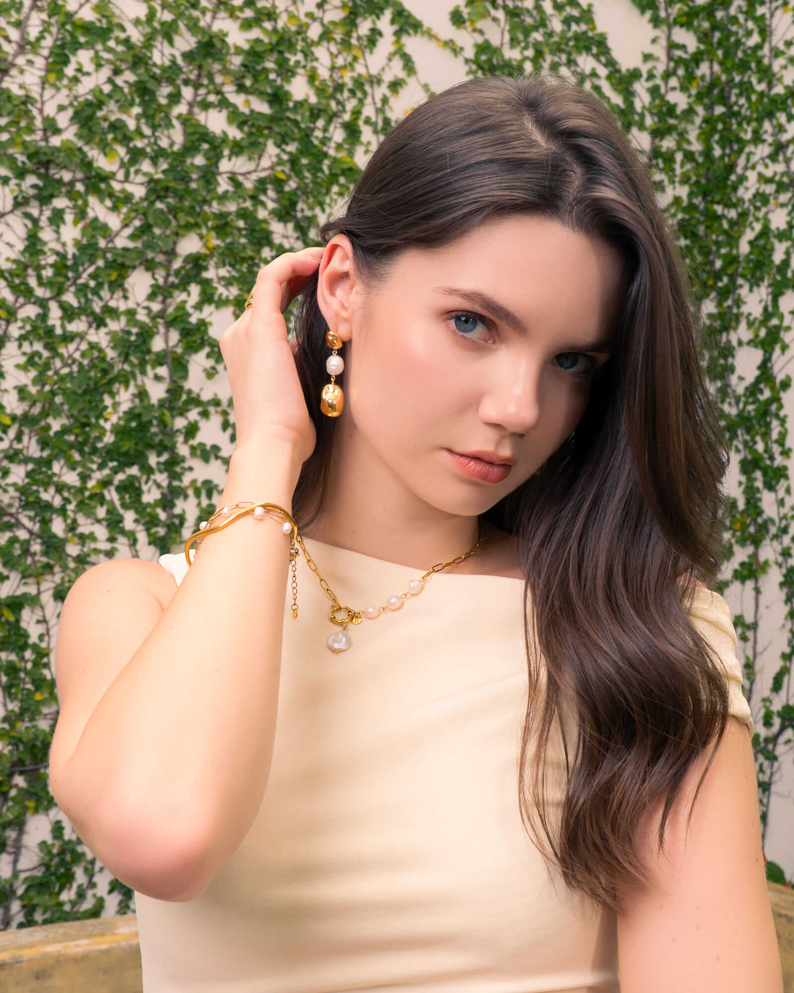 Salina Gold Pearl Bracelet by Lavana, on model; paperclip chain fine chain and floating freshwater pearls