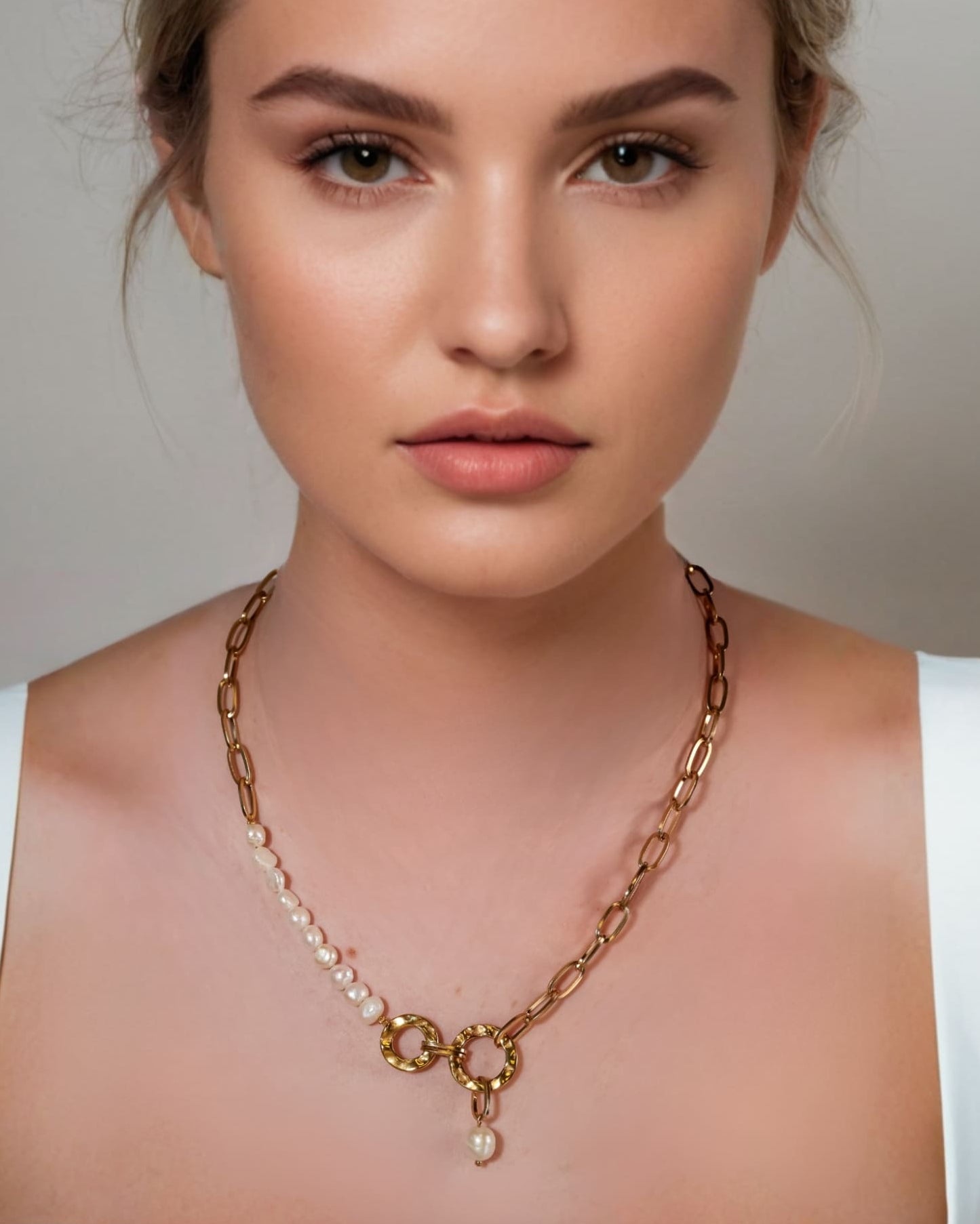 Sardinia Gold Pearl Necklace by Lavana on model with asymmetric links and freshwater pearl drop