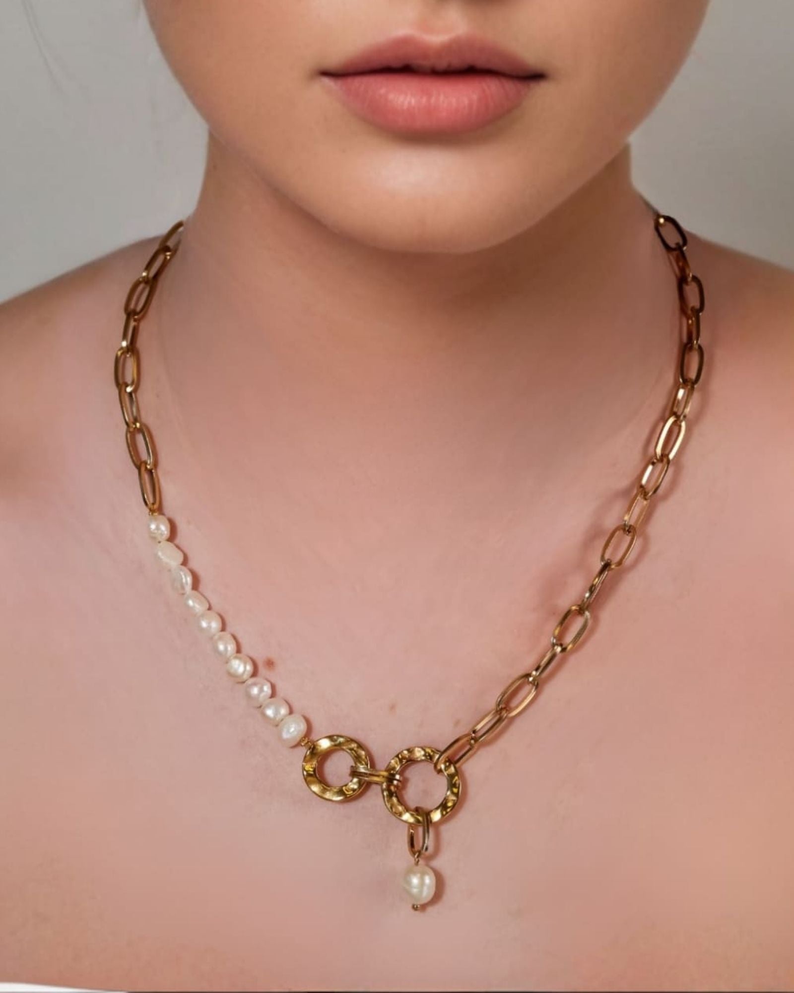 Sardinia Gold Pearl Necklace by Lavana on model with asymmetric links and freshwater pearl drop