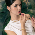 Sculptural Gold Hoop Earrings by LAVANA, on model; round dress hoops with soft sculptural twist X-Large 