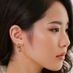 Sculptural Gold Hoop Earrings by Lavana on model round hoops with soft sculptural twist large