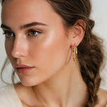 Sculptural Gold Hoop Earrings Extra Large by Lavana on model round hoops with soft sculptural twist