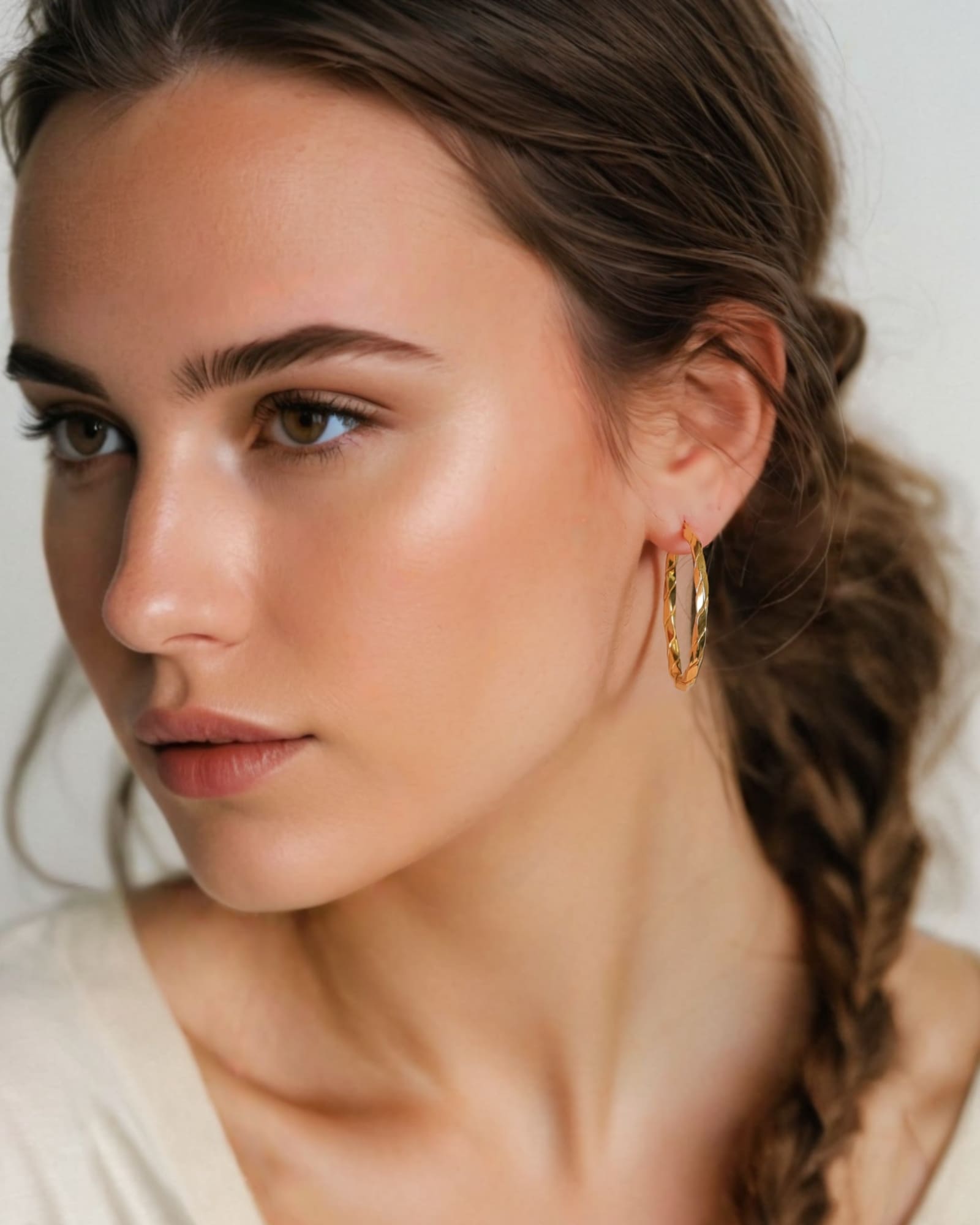 Sculptural Gold Hoop Earrings Extra Large by Lavana on model round hoops with soft sculptural twist