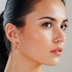 Sculptural Gold Hoop Earrings Large by Lavana on model round hoops with soft sculptural twist