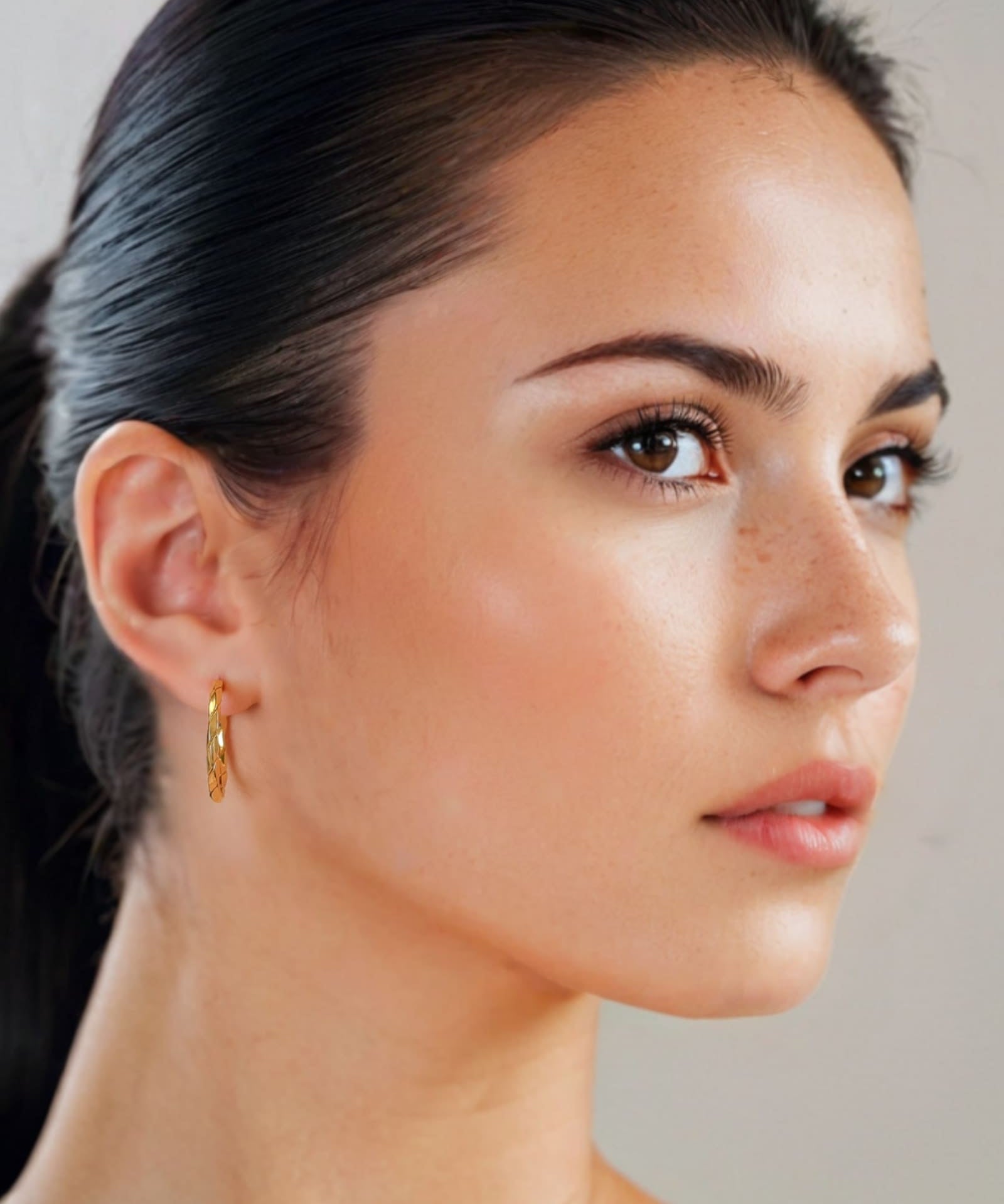 Sculptural Gold Hoop Earrings Large by Lavana on model round hoops with soft sculptural twist