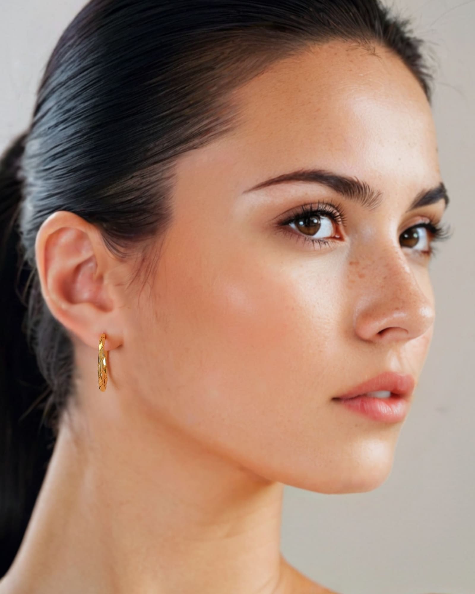 Sculptural Gold Hoop Earrings Large by Lavana on model round hoops with soft sculptural twist