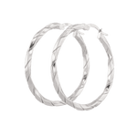 Sculptural Silver Hoop Earrings by Lavana, polished round hoops with gentle sculptural twist