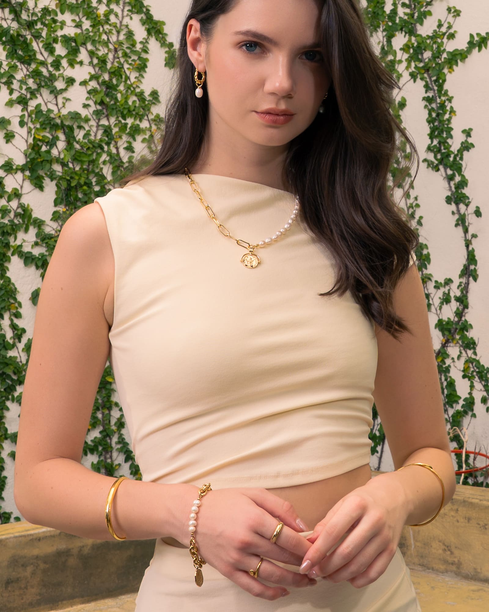 Sicily Gold Pearl Bracelet by Lavana, on model; modern chunky link chain with freshwater pearls and coin medallion