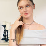 Sicily Silver Pearl Bracelet by Lavana, on model classic chunky link chain with freshwater pearls and coin medallion charm