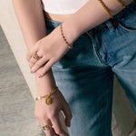 Sorrento Gold Pearl Bracelet by Lavana, on model; modern chunky link chain with pearl and medallion charm
