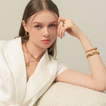 Starburst Coin Gold Necklace by Lavana, on model trendy coin pendant with engraved starburst compass