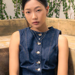 Sunshower Layered Silver Necklace by Lavana, on model; double layered chain with modern cloud charm and raindrop