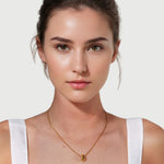 Sweetheart Gold Pendant by Lavana on model stacked heart motif charm