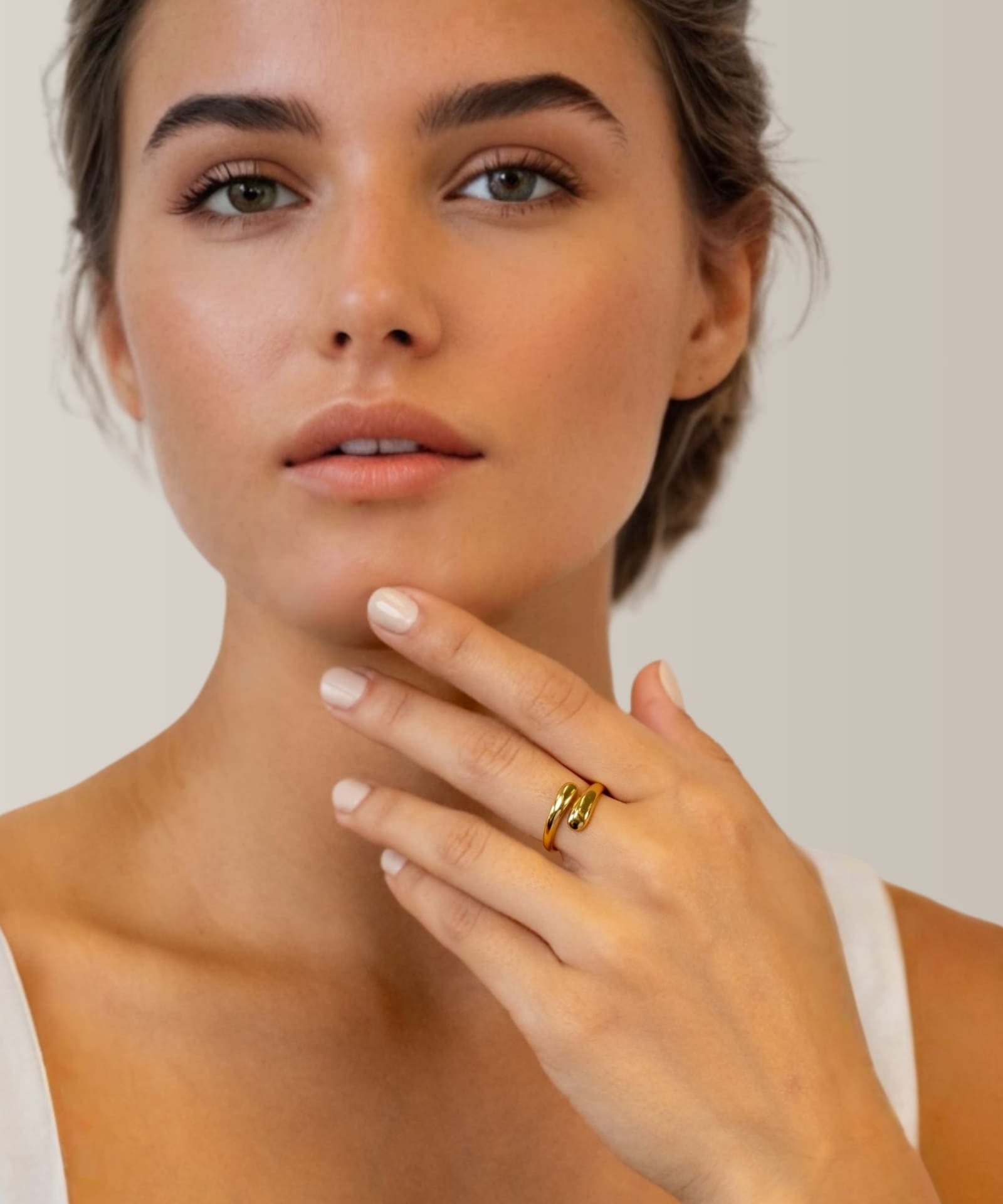 Swerve gold wrap ring by Lavana on model with polished by pass curve