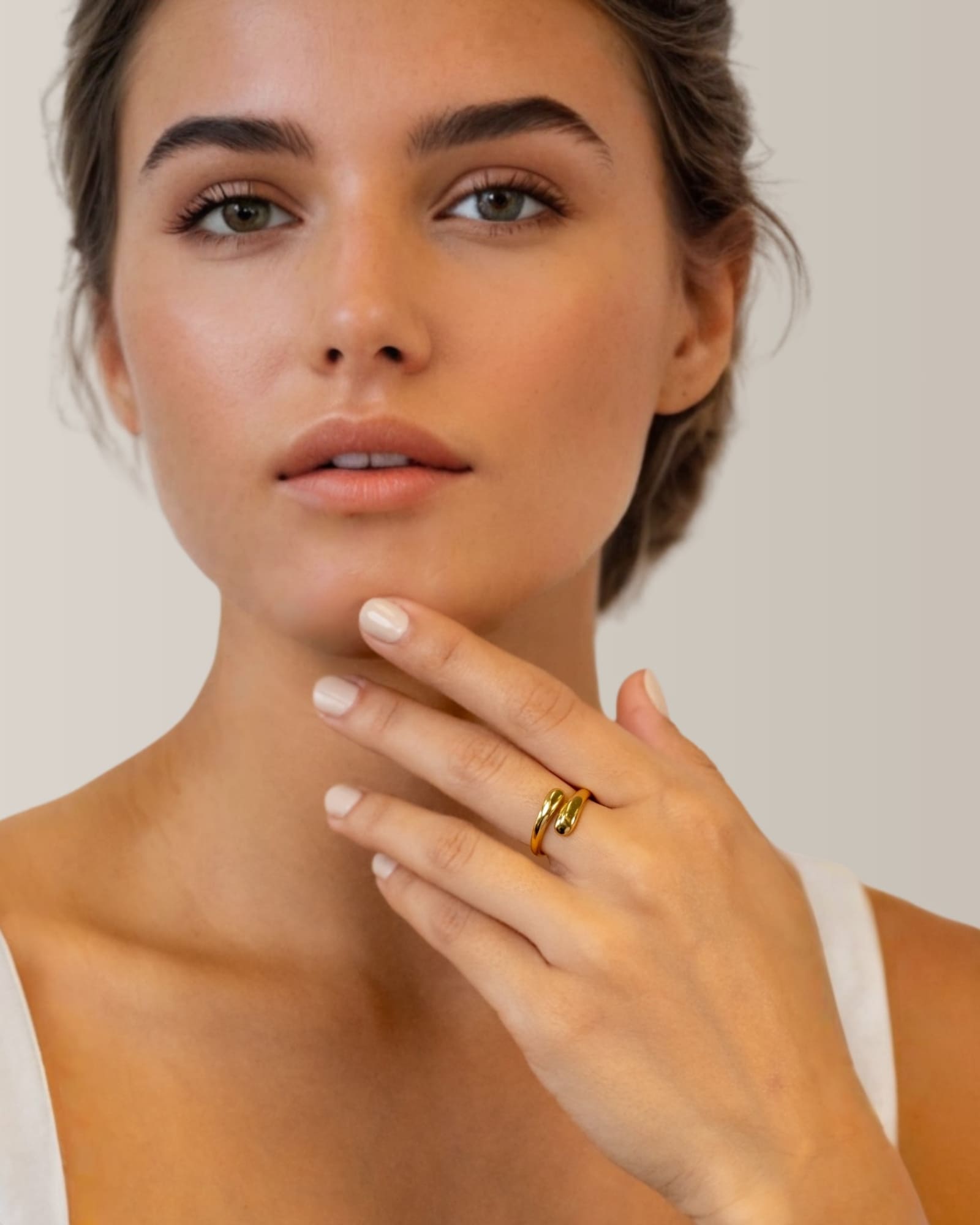 Swerve gold wrap ring by Lavana on model with polished by pass curve