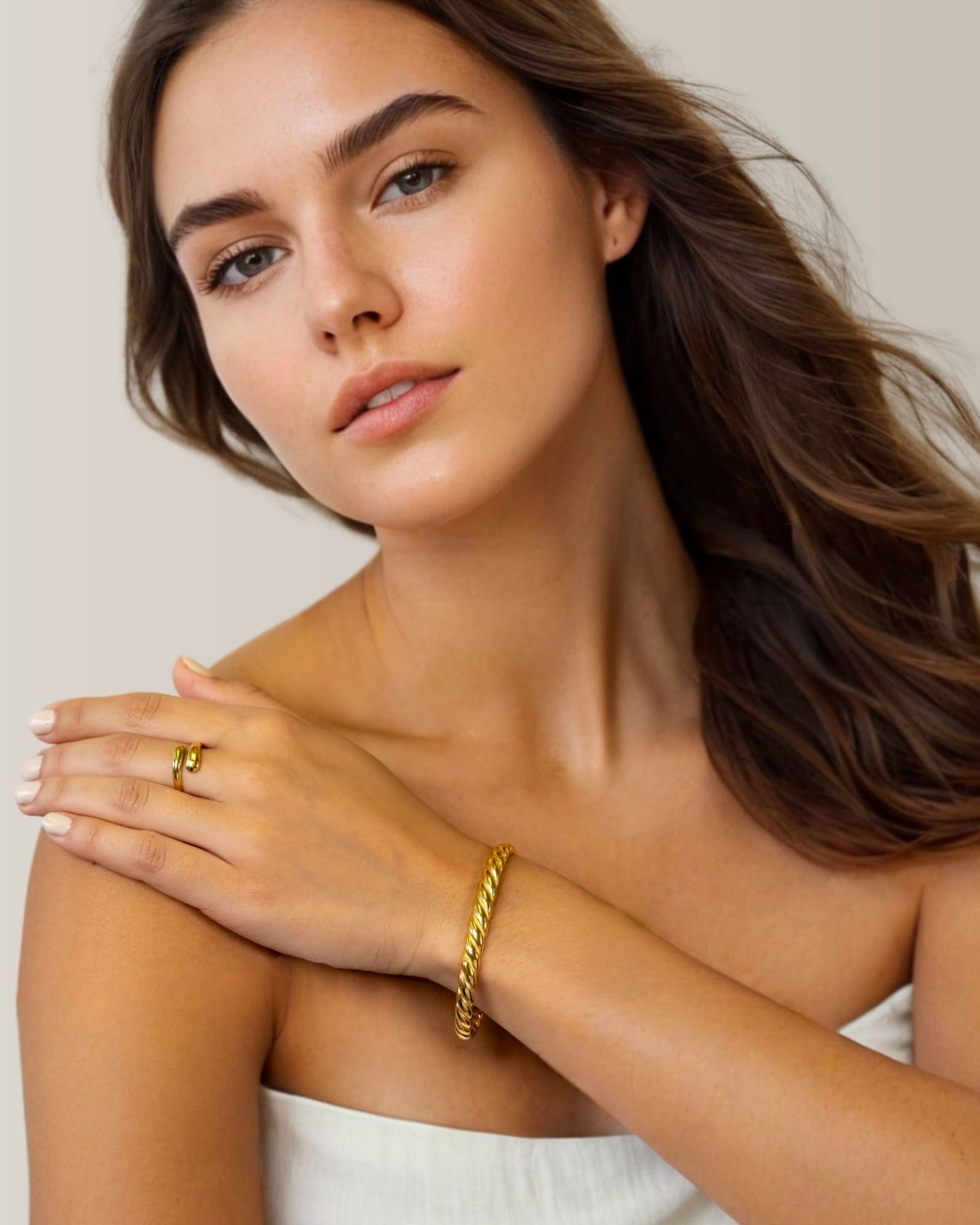 Swerve gold wrap ring by Lavana on model with polished by pass curve
