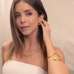 Tiny Pebbles Gold Hoop Earrings by Lavana, on model; double row of polished beads in an open dress hoops