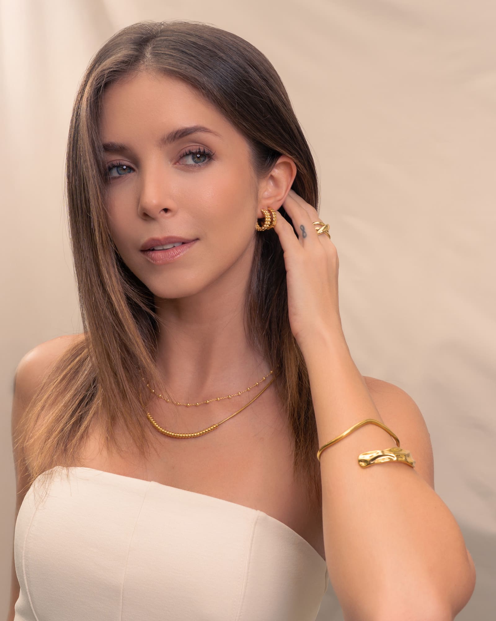 Tiny Pebbles Gold Hoop Earrings by Lavana, on model; double row of polished beads in an open dress hoops