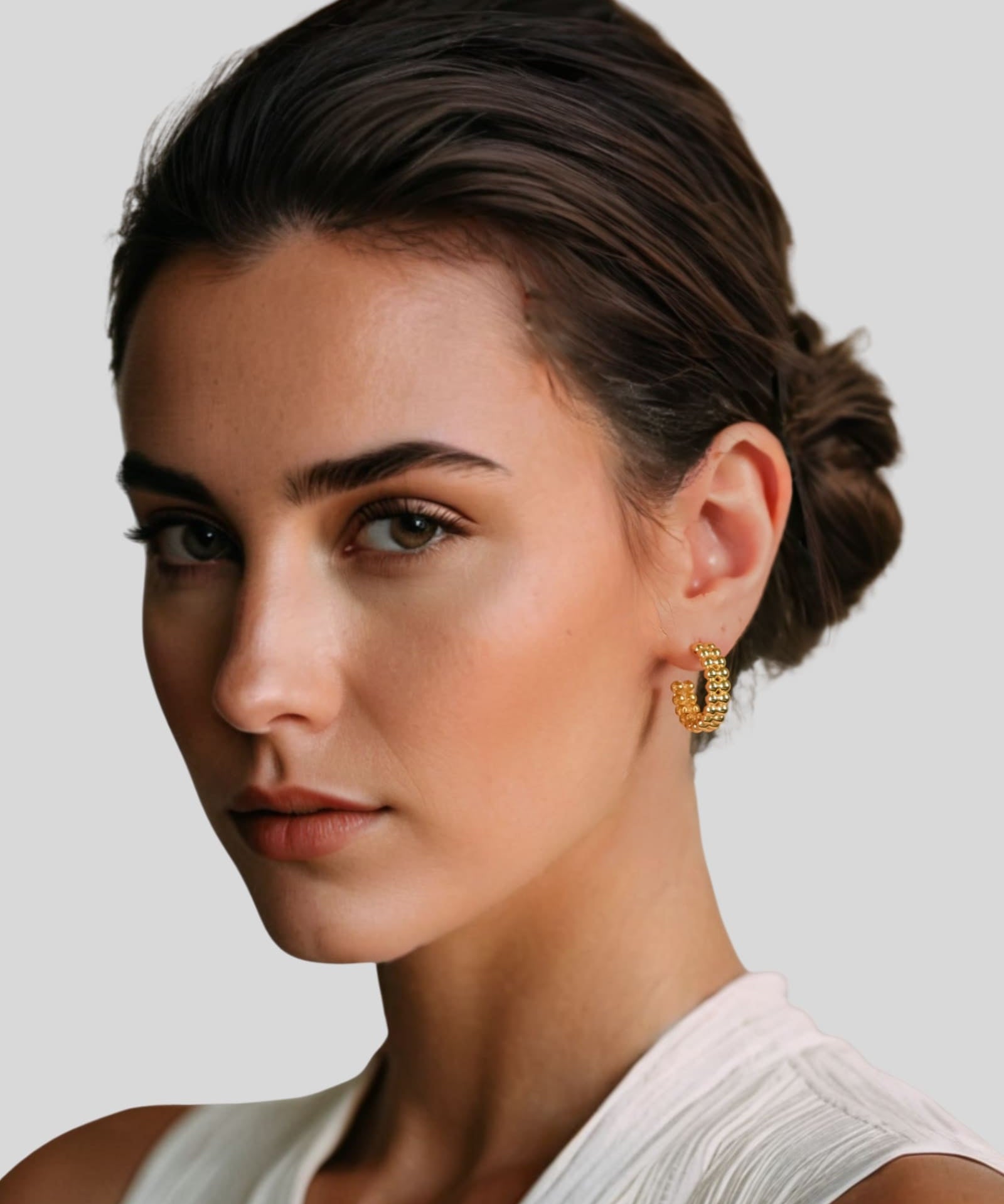 Tiny Pebbles Gold Hoop Earrings by Lavana on model double row of polished beads in an open hoop