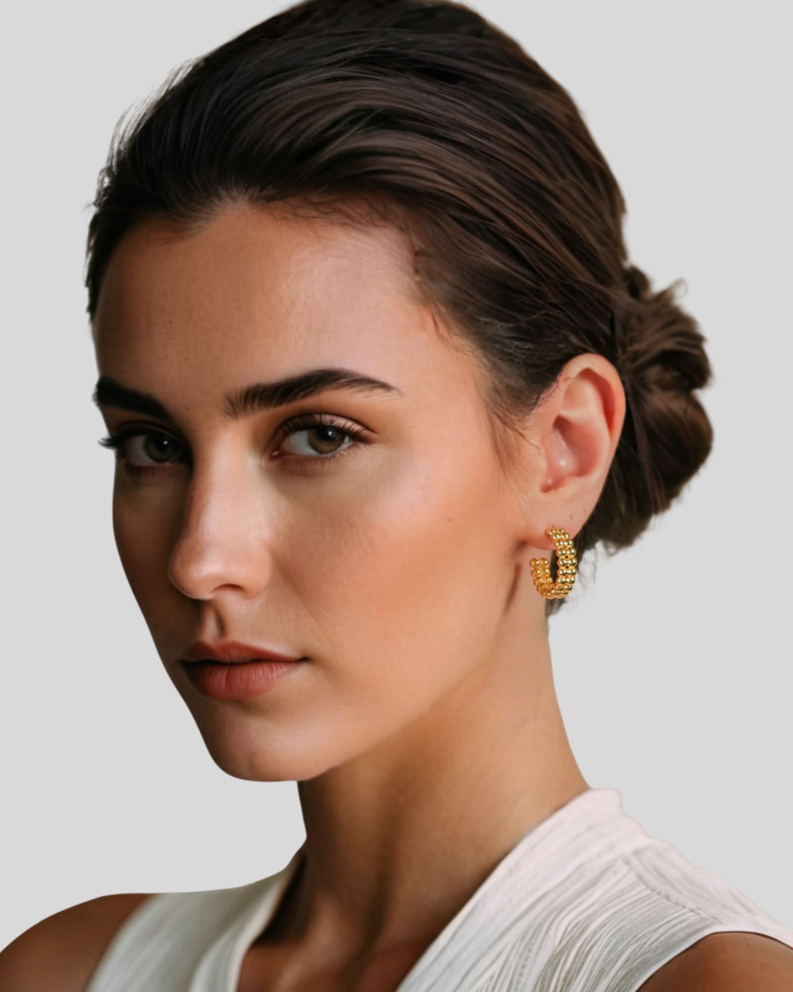 Tiny Pebbles Gold Hoop Earrings by Lavana on model double row of polished beads in an open hoop