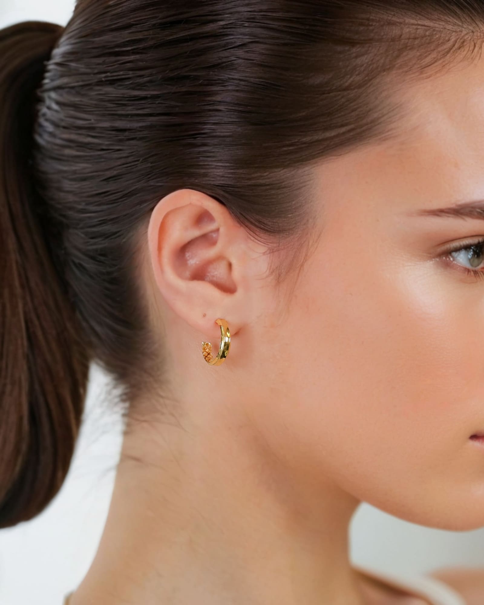 Tranquil Gold Hoop Earrings by Lavana on model layered front with inner patterned gallery