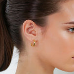 Tranquil Gold Hoop Earrings by Lavana on model layered front with inner patterned gallery