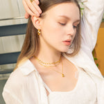 Valencia Beaded Tube Gold Chain Necklace by Lavana, on model fine modern chain with polished beaded tube stations
