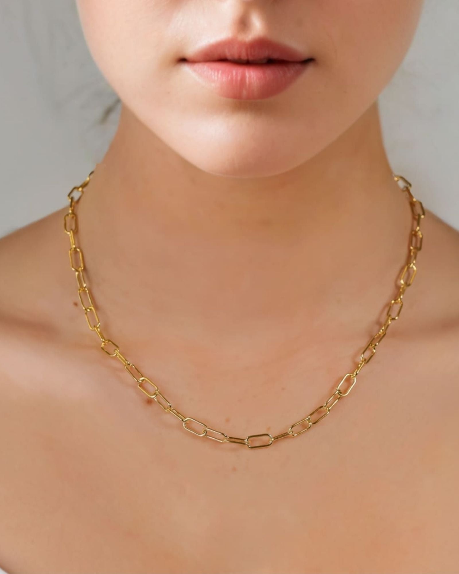 Verona Gold Paperclip Chain Necklace by Lavana on model with elongated polished links