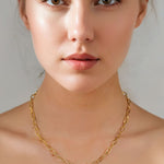 Verona Gold Paperclip Chain Necklace by Lavana on model with elongated polished links