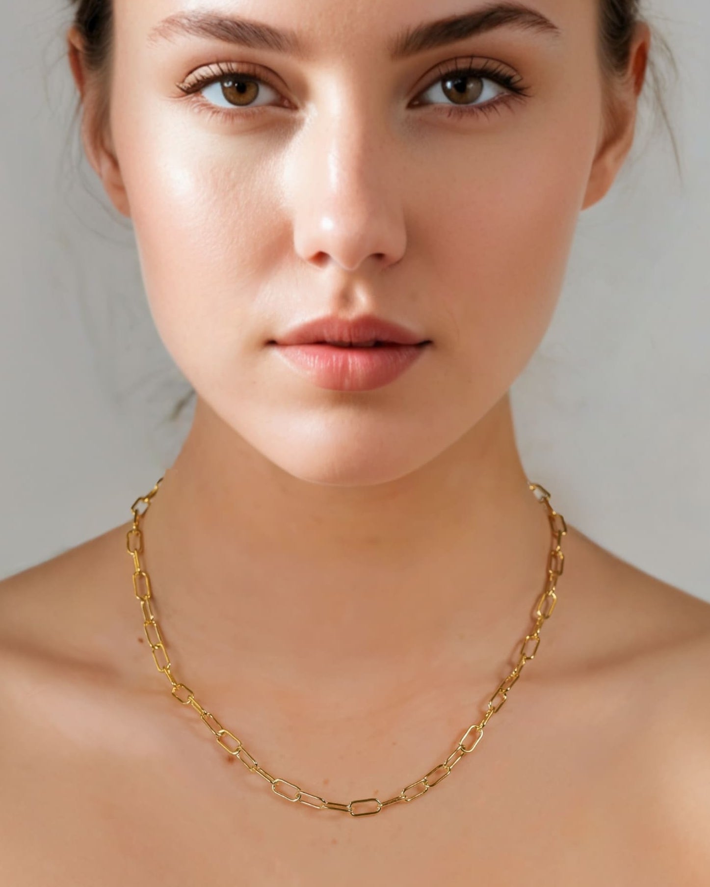 Verona Gold Paperclip Chain Necklace by Lavana on model with elongated polished links