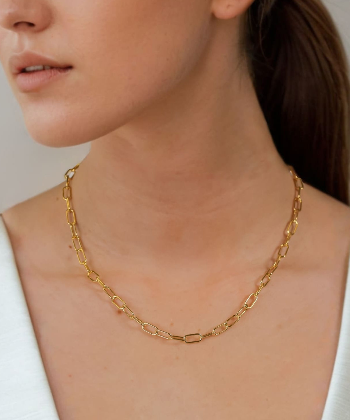 Verona Gold Paperclip Chain Necklace by Lavana on model with elongated polished links