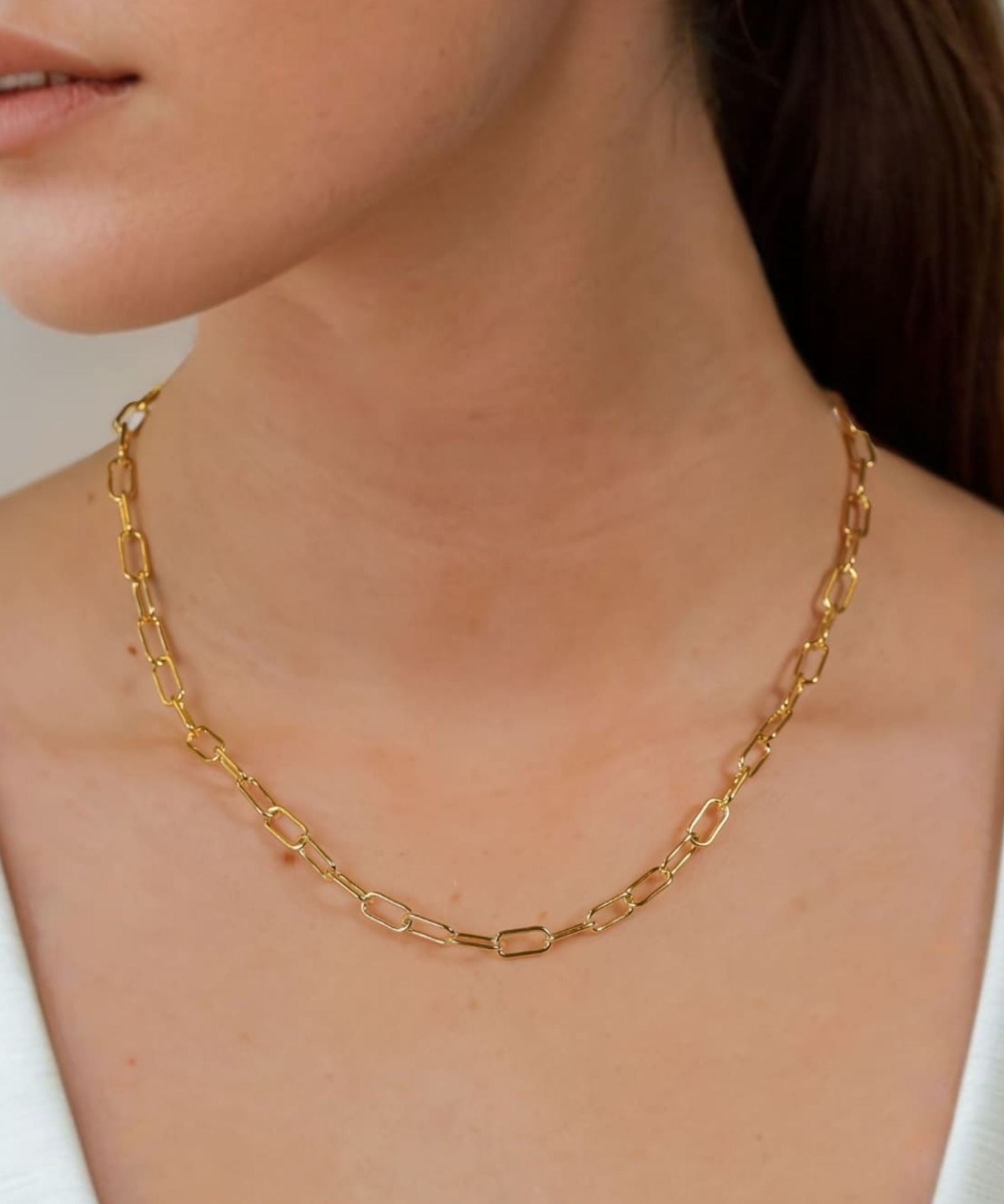 Verona Gold Paperclip Chain Necklace by Lavana on model with elongated polished links