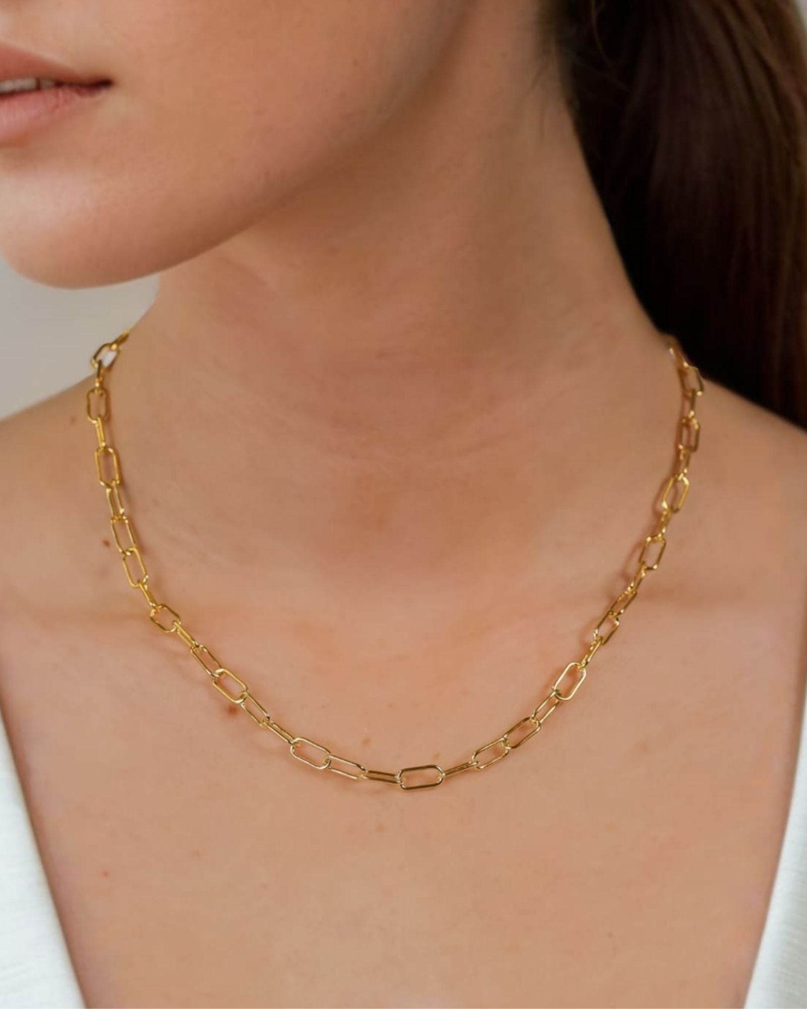 Verona Gold Paperclip Chain Necklace by Lavana on model with elongated polished links