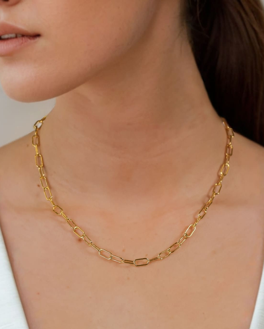Verona Gold Paperclip Chain Necklace by Lavana on model with elongated polished links
