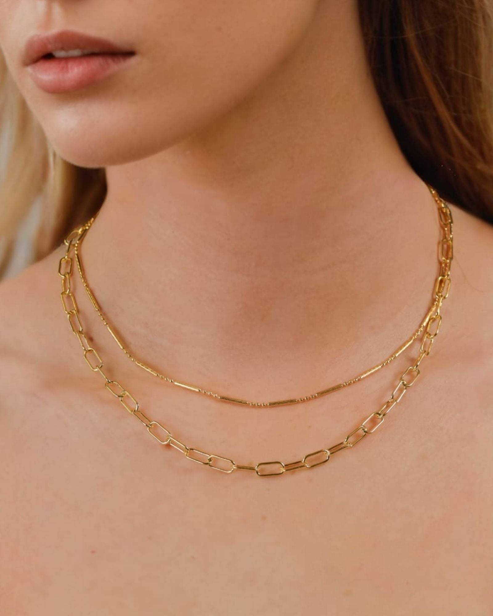 Verona Gold Paperclip Chain Necklace by Lavana on model with elongated polished links