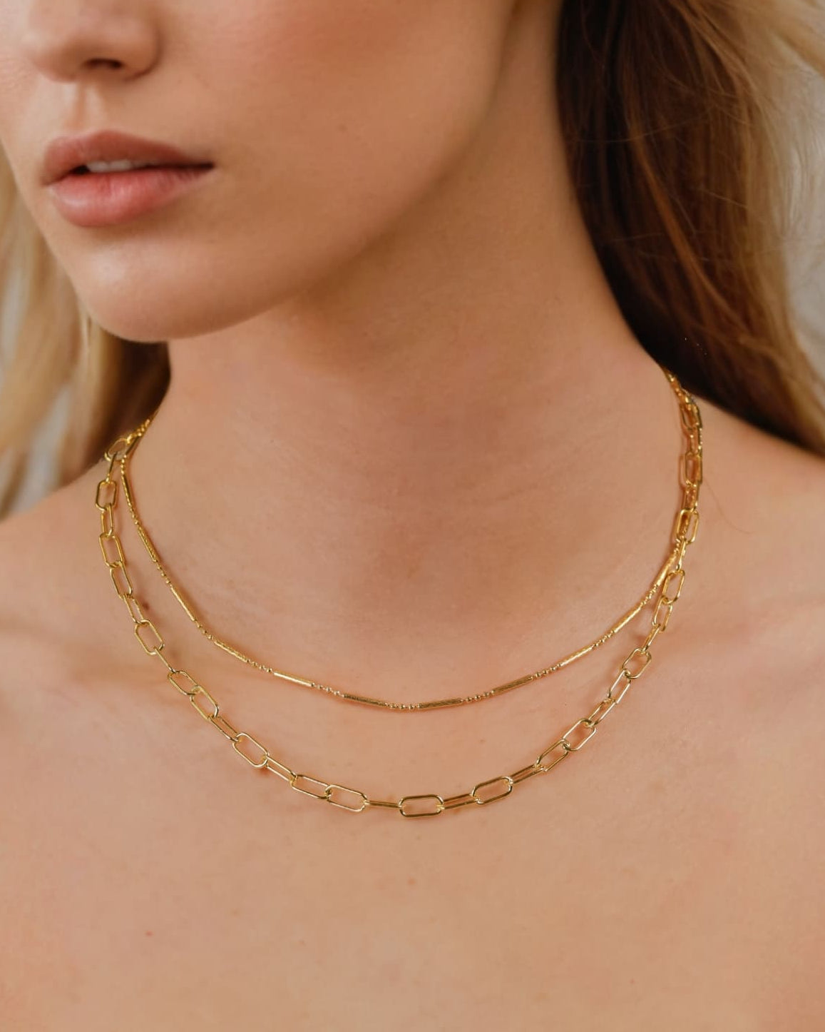 Verona Gold Paperclip Chain Necklace by Lavana on model with elongated polished links