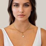 Vista Charm Gold Chain Necklace by Lavana, on model; with front charm ring Mondello Pearl Pendant with sculptural teardrop 