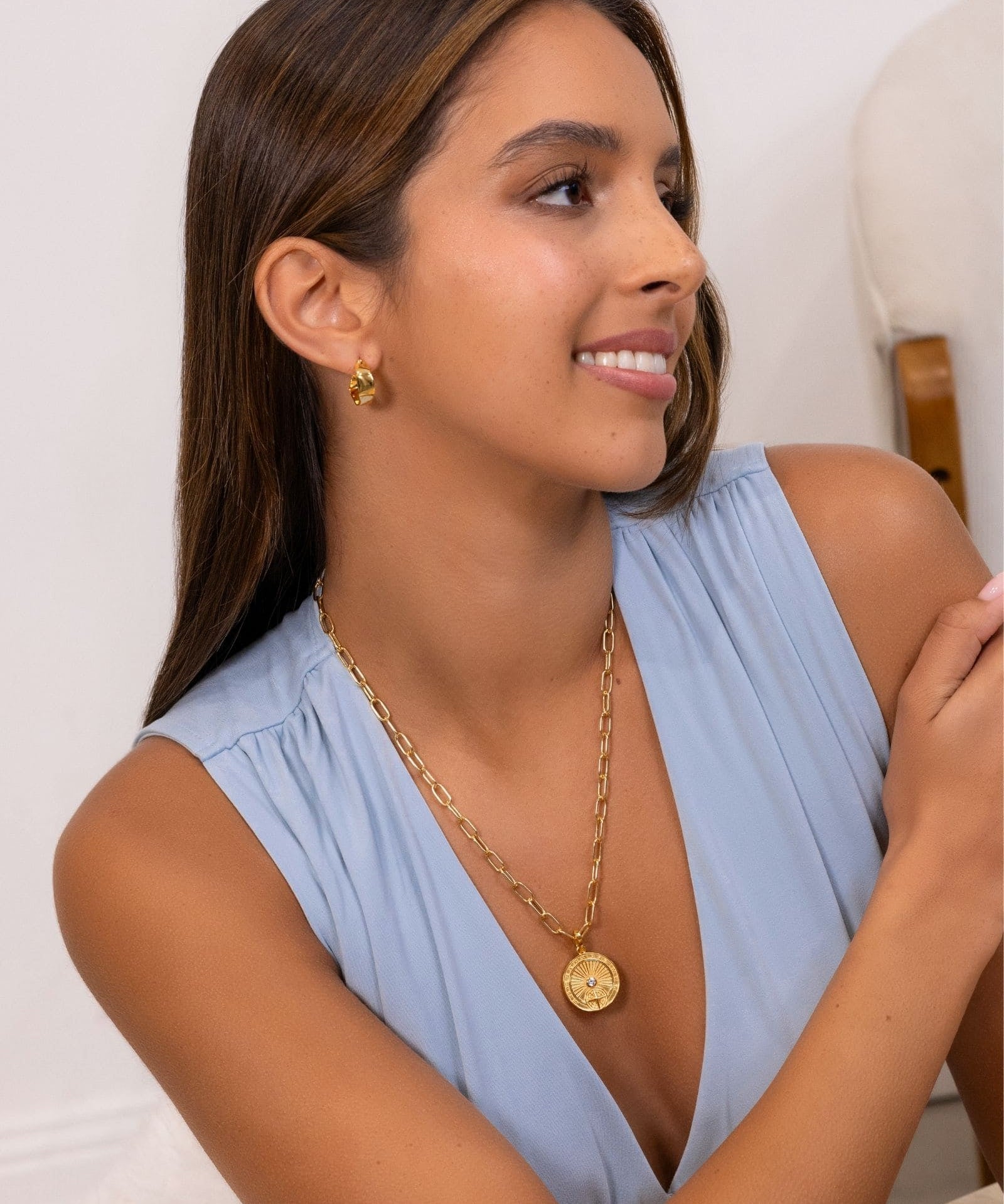 Voyage Compass Diamond Pendant by Lavana on model in 18k gold plated sterling silver with polished compass face